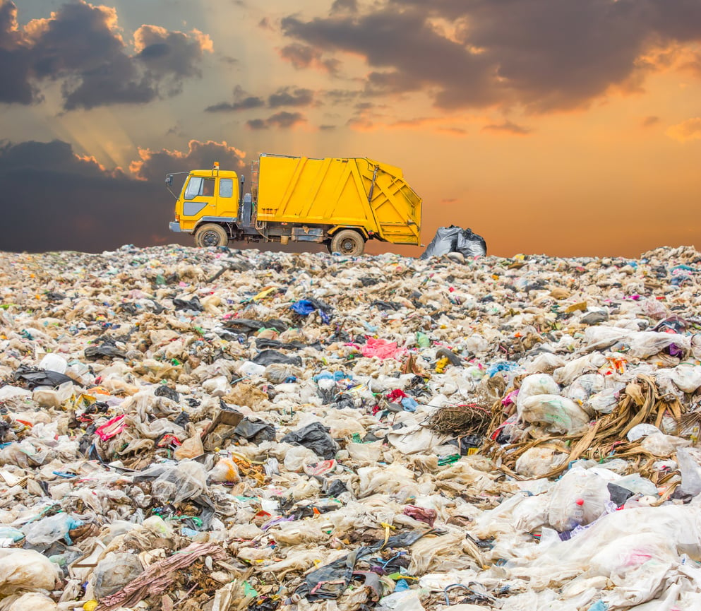 truck dumping garbage  in trash dump or landfill